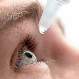 Dripping eye with eyes drops